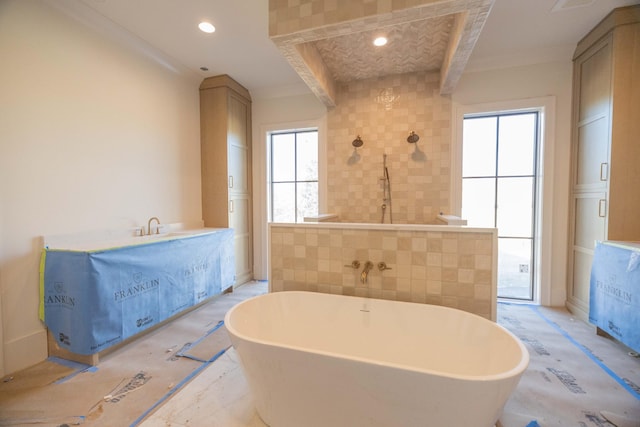 bathroom with tile walls and a bathing tub