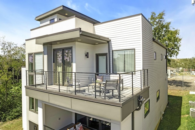 back of house with a balcony