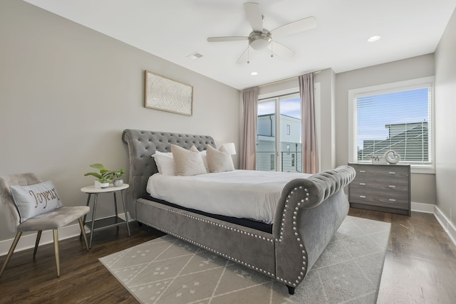 bedroom featuring ceiling fan and dark hardwood / wood-style floors