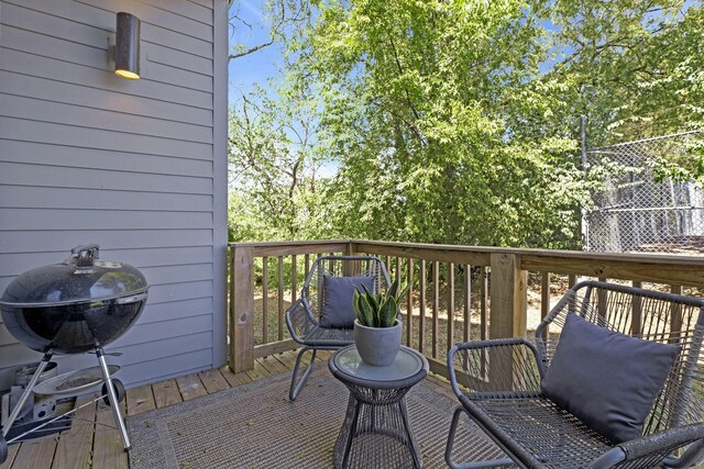 wooden deck with grilling area