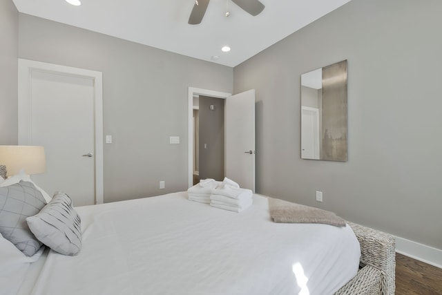 bedroom with dark wood-type flooring and ceiling fan