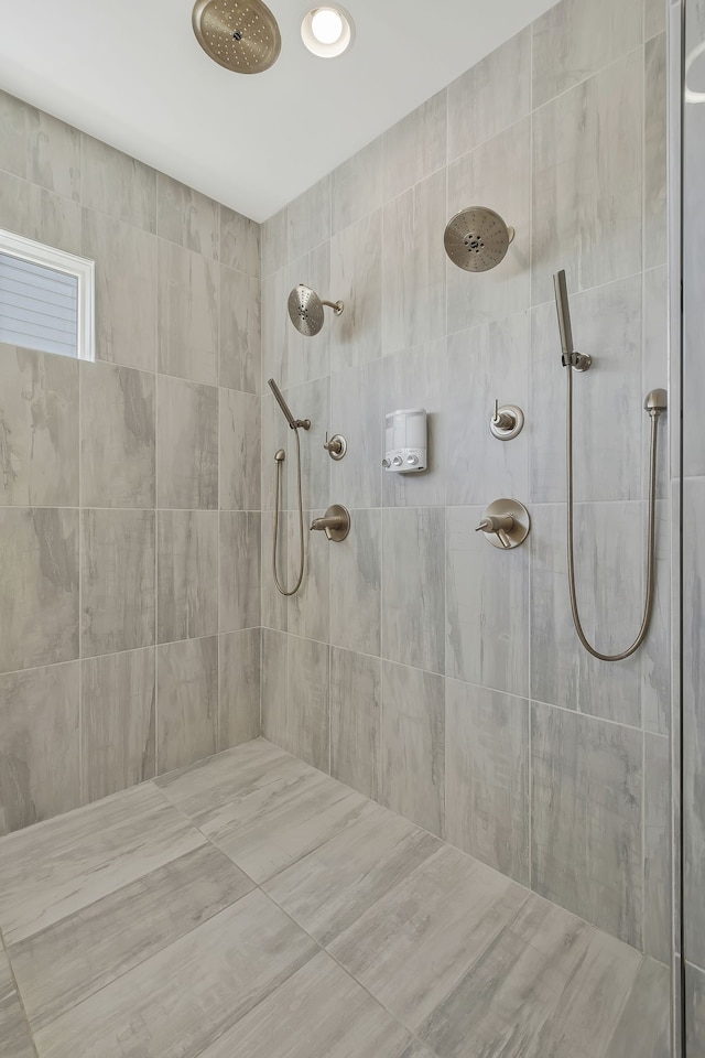 bathroom with a tile shower