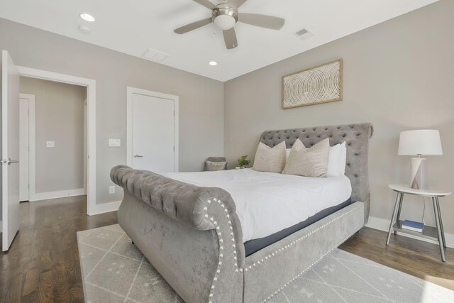 bedroom featuring dark hardwood / wood-style flooring and ceiling fan