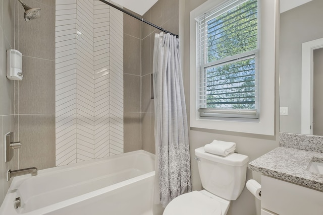 full bathroom with shower / bath combination with curtain, vanity, plenty of natural light, and toilet