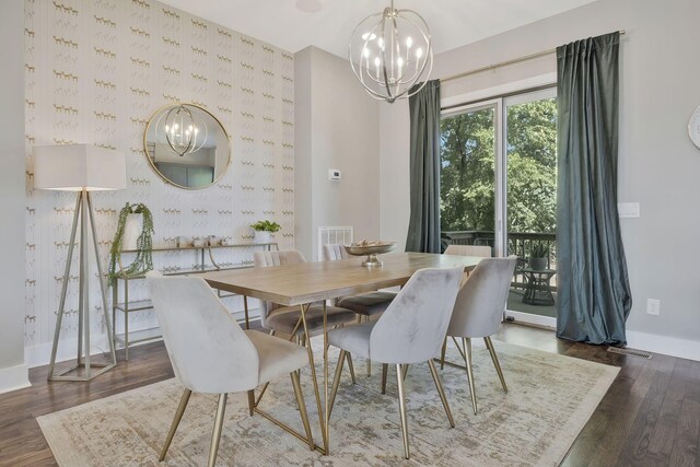 dining room featuring a chandelier and dark wood-type flooring