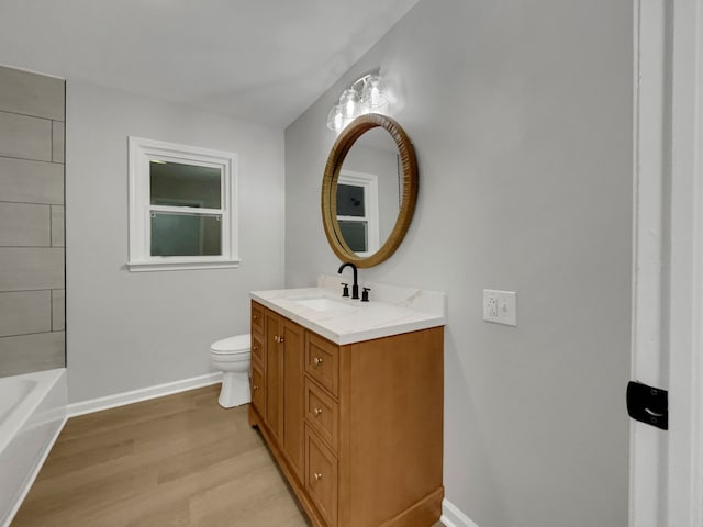 full bathroom with vanity, independent shower and bath, hardwood / wood-style floors, and toilet