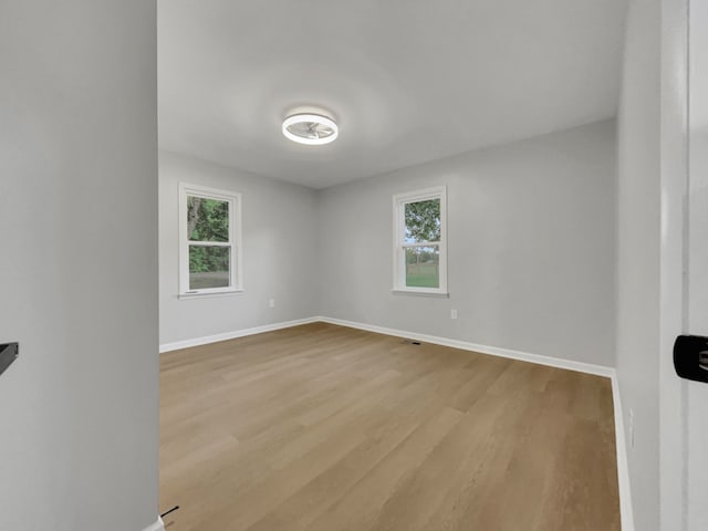 unfurnished room featuring light hardwood / wood-style flooring