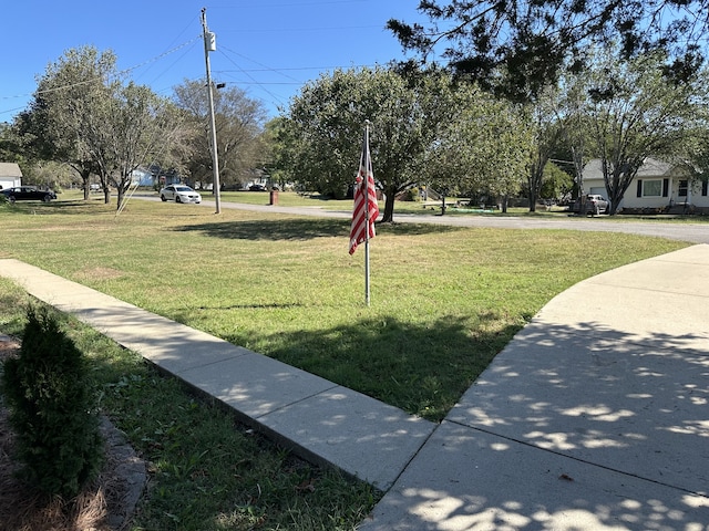 surrounding community with a lawn