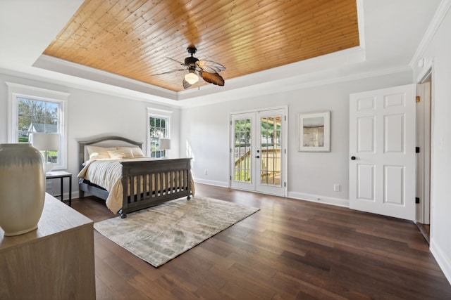 bedroom with french doors, dark hardwood / wood-style floors, and multiple windows