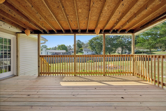 wooden terrace with a yard