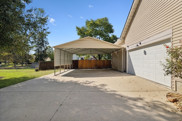 view of vehicle parking with a yard and a carport