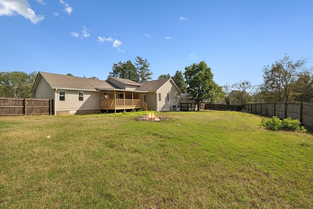 view of yard with a wooden deck