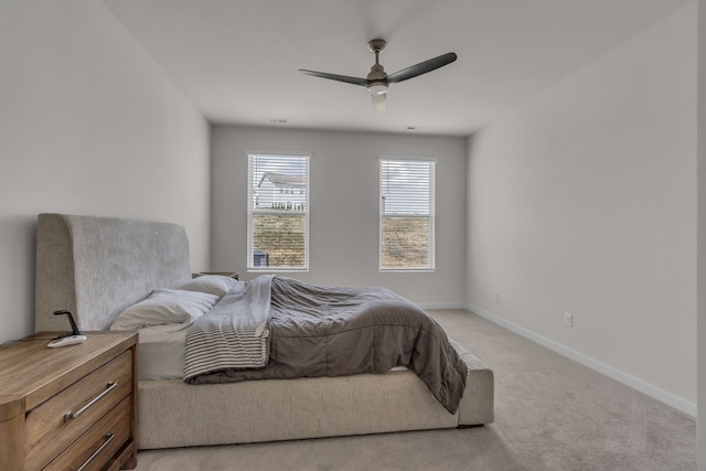 bedroom featuring ceiling fan and light colored carpet