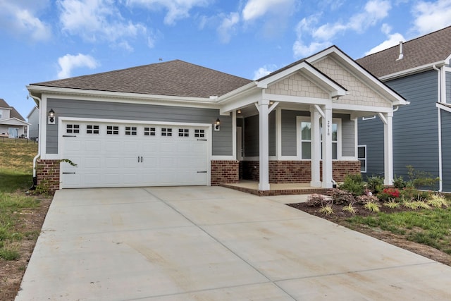 craftsman-style house featuring a porch and a garage