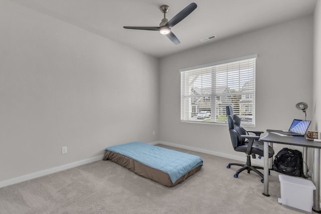 bedroom with ceiling fan and light colored carpet