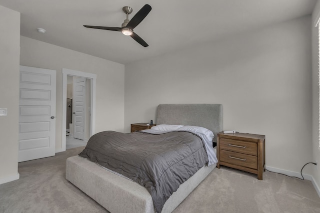 bedroom featuring ceiling fan and light colored carpet