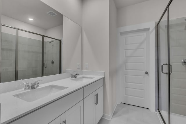 bathroom featuring vanity and an enclosed shower