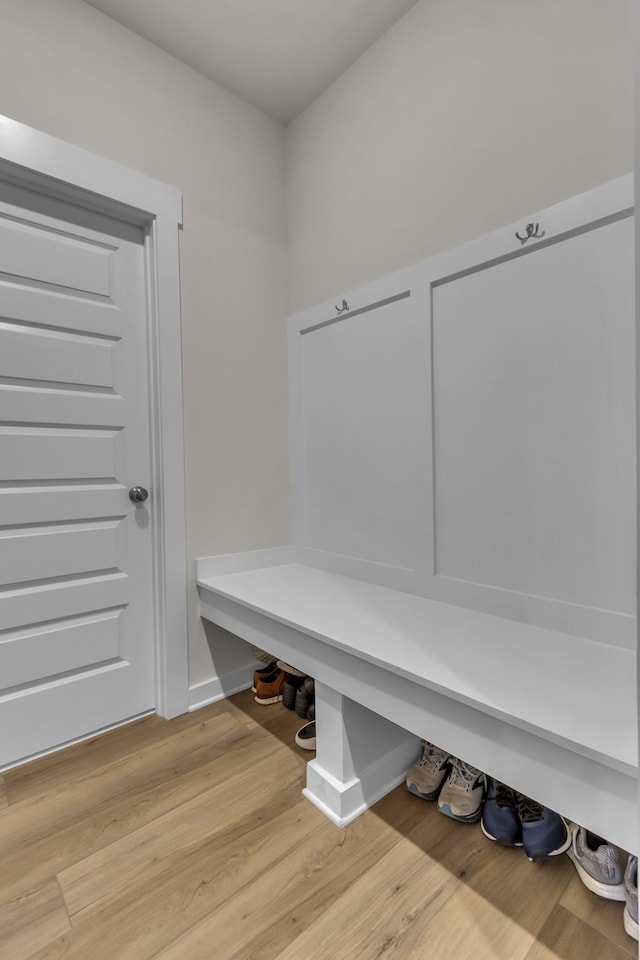 mudroom with light hardwood / wood-style floors