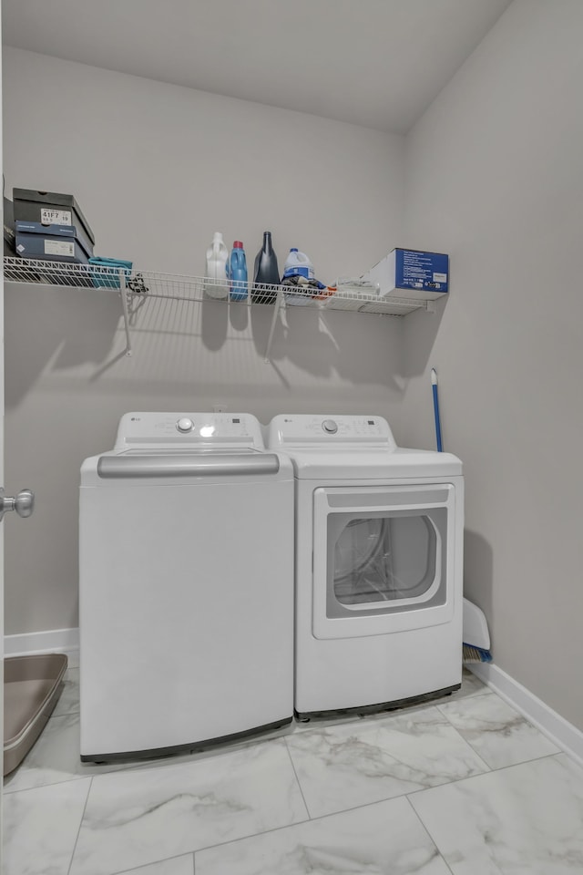 clothes washing area with independent washer and dryer