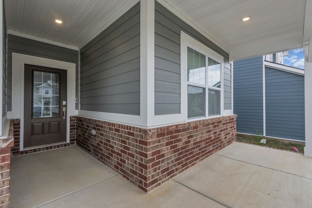 doorway to property featuring a porch