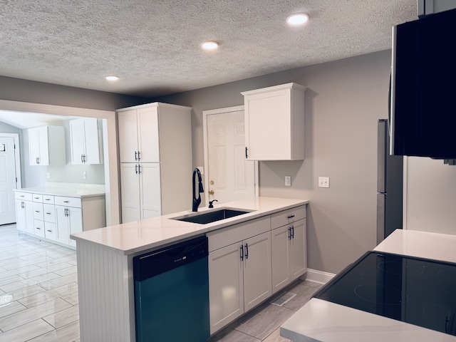 kitchen featuring white cabinets, a textured ceiling, sink, and dishwashing machine