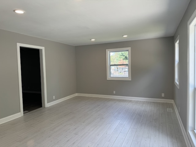 spare room with light hardwood / wood-style floors