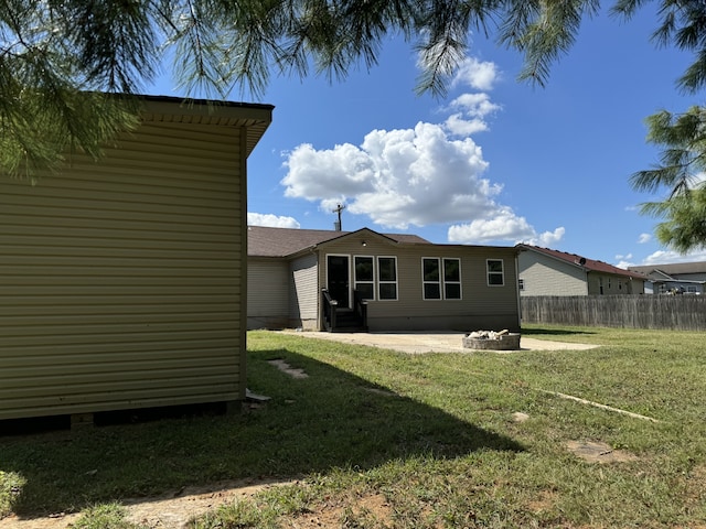 view of yard with a patio and a fire pit