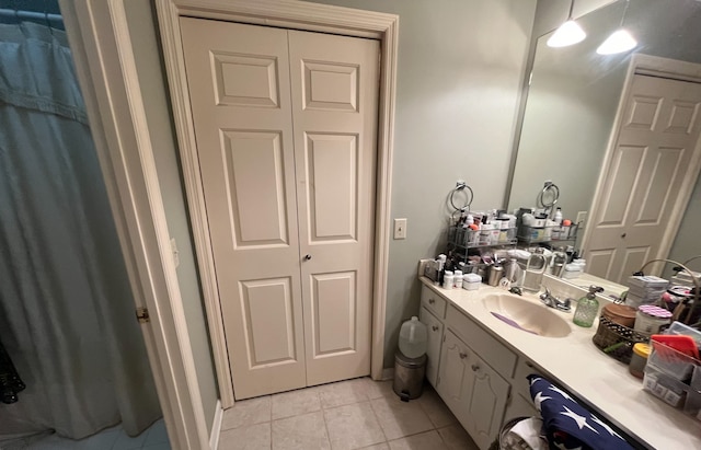 bathroom with tile patterned floors and vanity