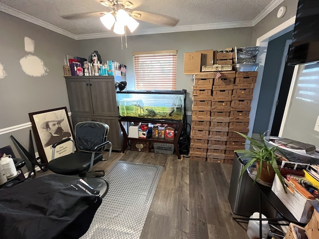 bedroom with dark wood-type flooring, ornamental molding, and a textured ceiling