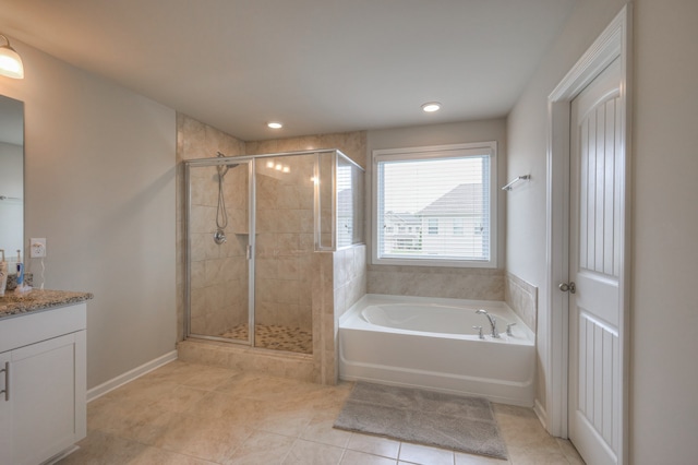 bathroom featuring independent shower and bath, vanity, and tile patterned floors