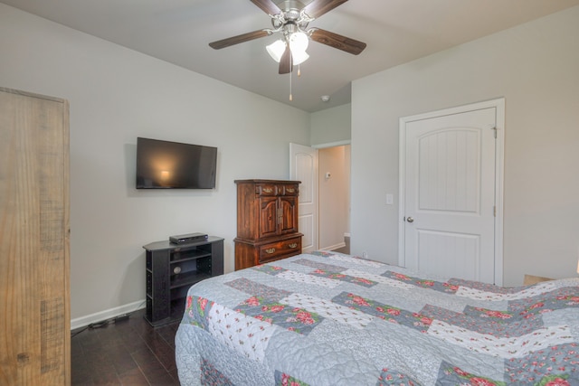 bedroom featuring ceiling fan and dark hardwood / wood-style floors