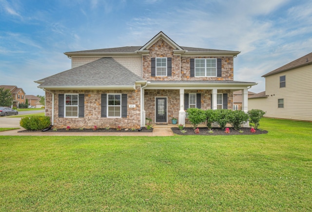 view of front of house with a porch and a front lawn