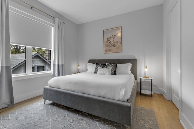 bedroom with light wood-type flooring