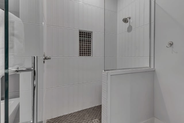 bathroom featuring an enclosed shower