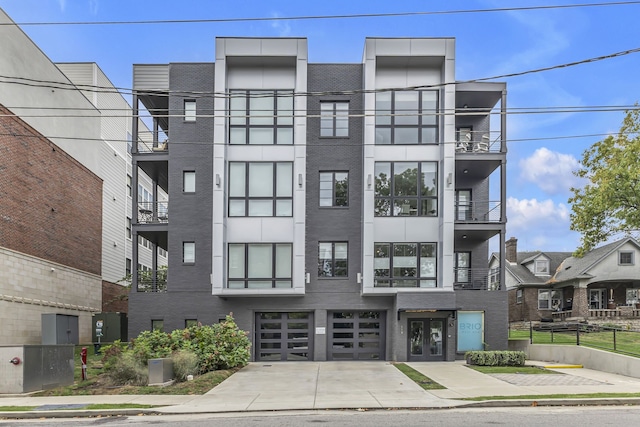 view of front of property with a balcony and french doors