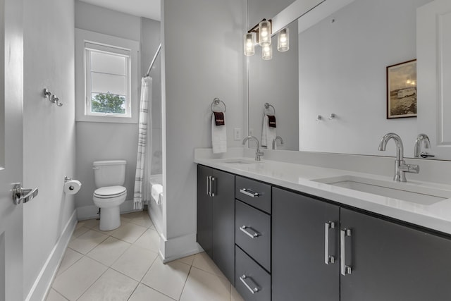 full bathroom with vanity, toilet, shower / bathtub combination with curtain, and tile patterned floors