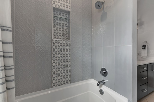 bathroom with vanity, shower / bath combo with shower curtain, and tile patterned flooring