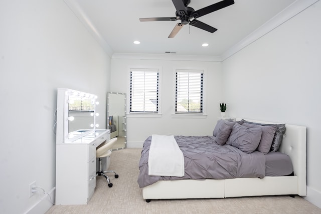 bedroom featuring crown molding, light carpet, and ceiling fan