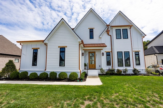 6821 Springwater St, Smyrna, TN 37167 - modern farmhouse featuring metal roof, a standing seam roof, board and batten siding, and a front yard