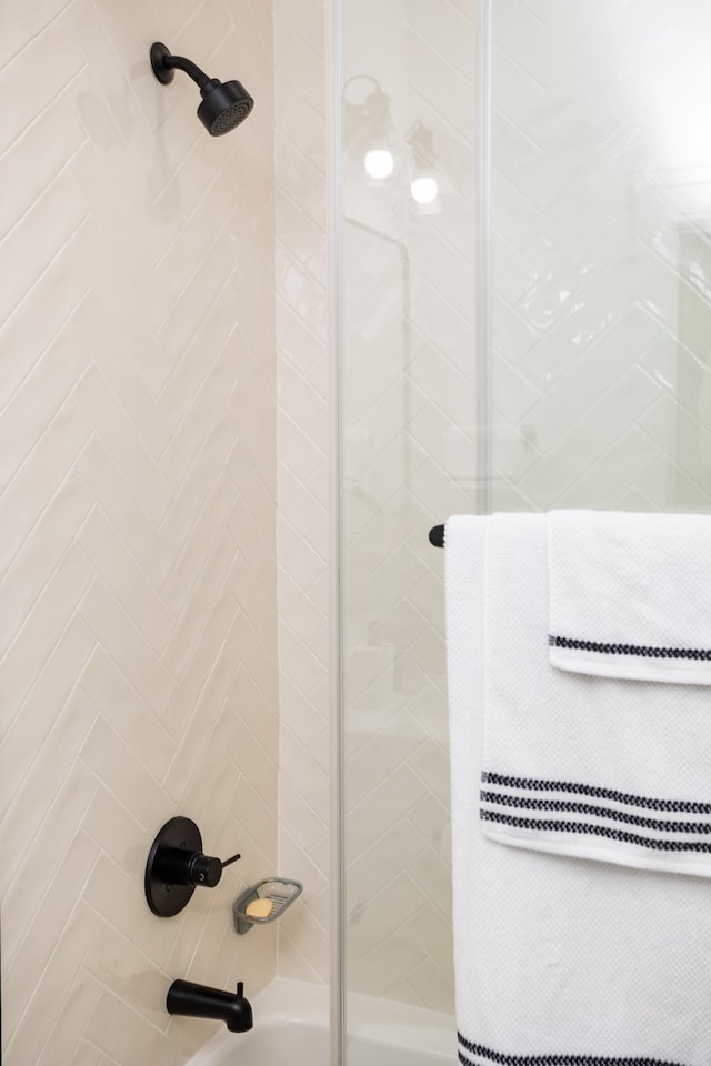 bathroom with tiled shower