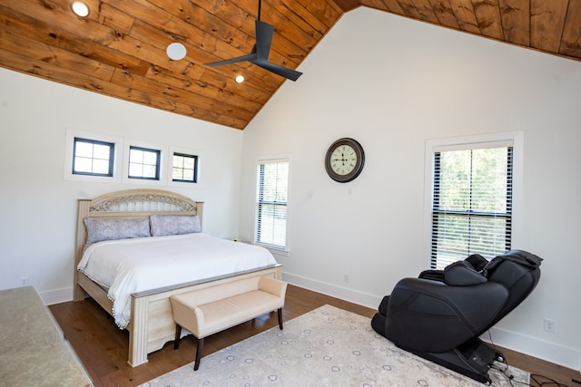 bedroom with dark wood-type flooring, high vaulted ceiling, and wooden ceiling