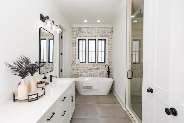 bathroom featuring ornamental molding, tile patterned flooring, vanity, and separate shower and tub