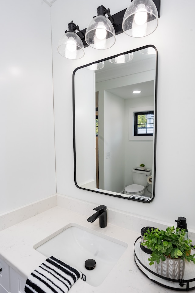 bathroom with vanity and toilet