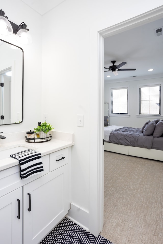 bathroom with ceiling fan and vanity