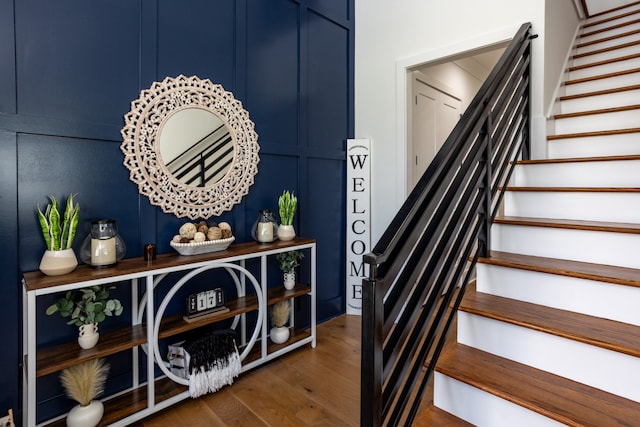 stairway featuring hardwood / wood-style floors