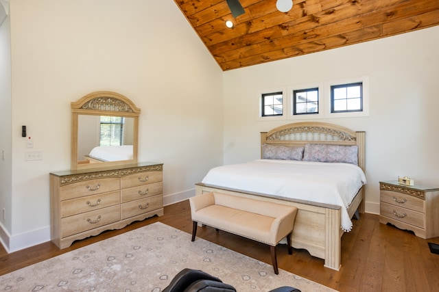 bedroom with ceiling fan, hardwood / wood-style flooring, wood ceiling, and high vaulted ceiling