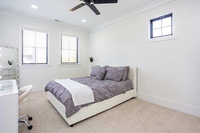 bedroom featuring ceiling fan, light carpet, and ornamental molding