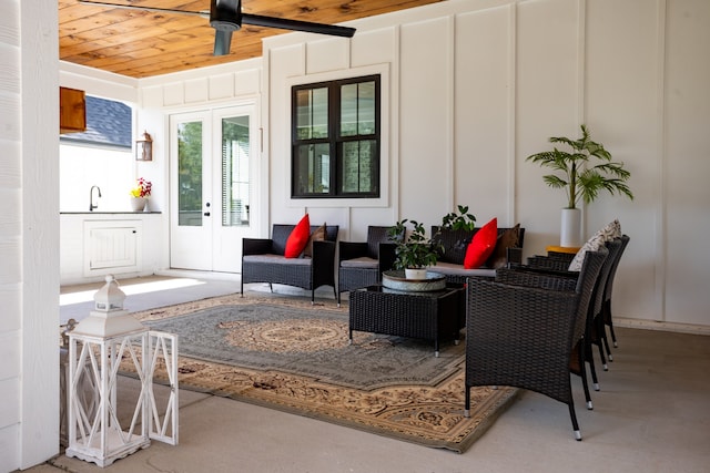 interior space featuring ceiling fan, sink, outdoor lounge area, and french doors