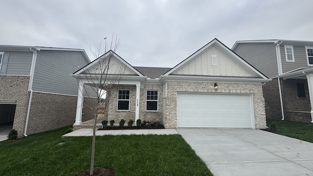 view of front of home with a garage and a front lawn