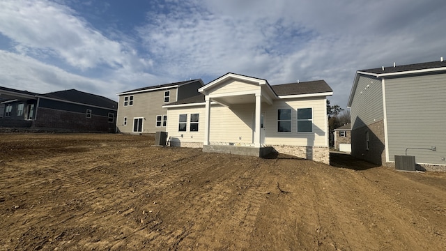 rear view of property featuring central AC